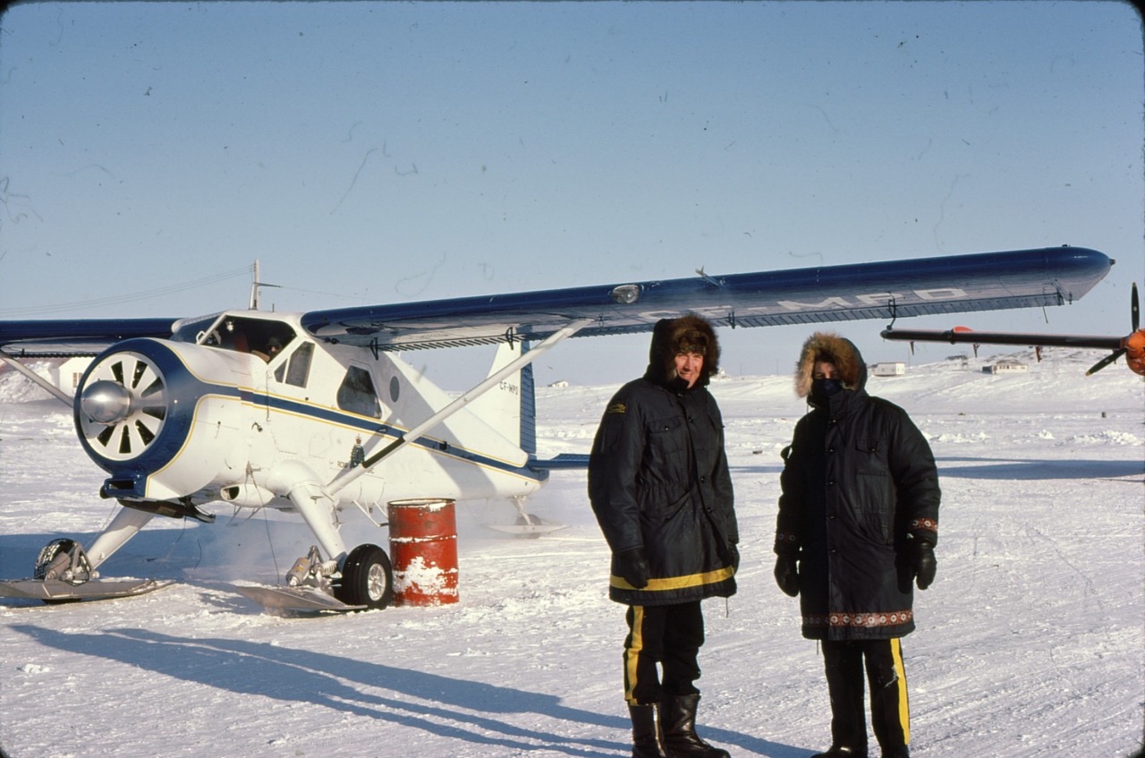 628d23e9e74225daa6fb3ed8_Happy Mounties warming up engine, Inukjuak `75 Large